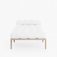 White day bed with beige frame on white backdrop