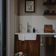 Kitchen interior with wood cabinets and white splashback