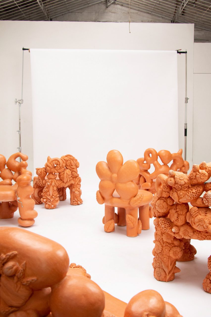 Terracotta chairs by Chris Wolston in a studio