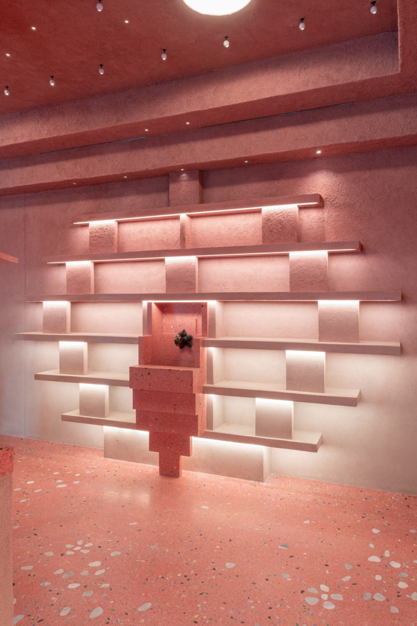 Pink shop display wall by Clayworks with shelving