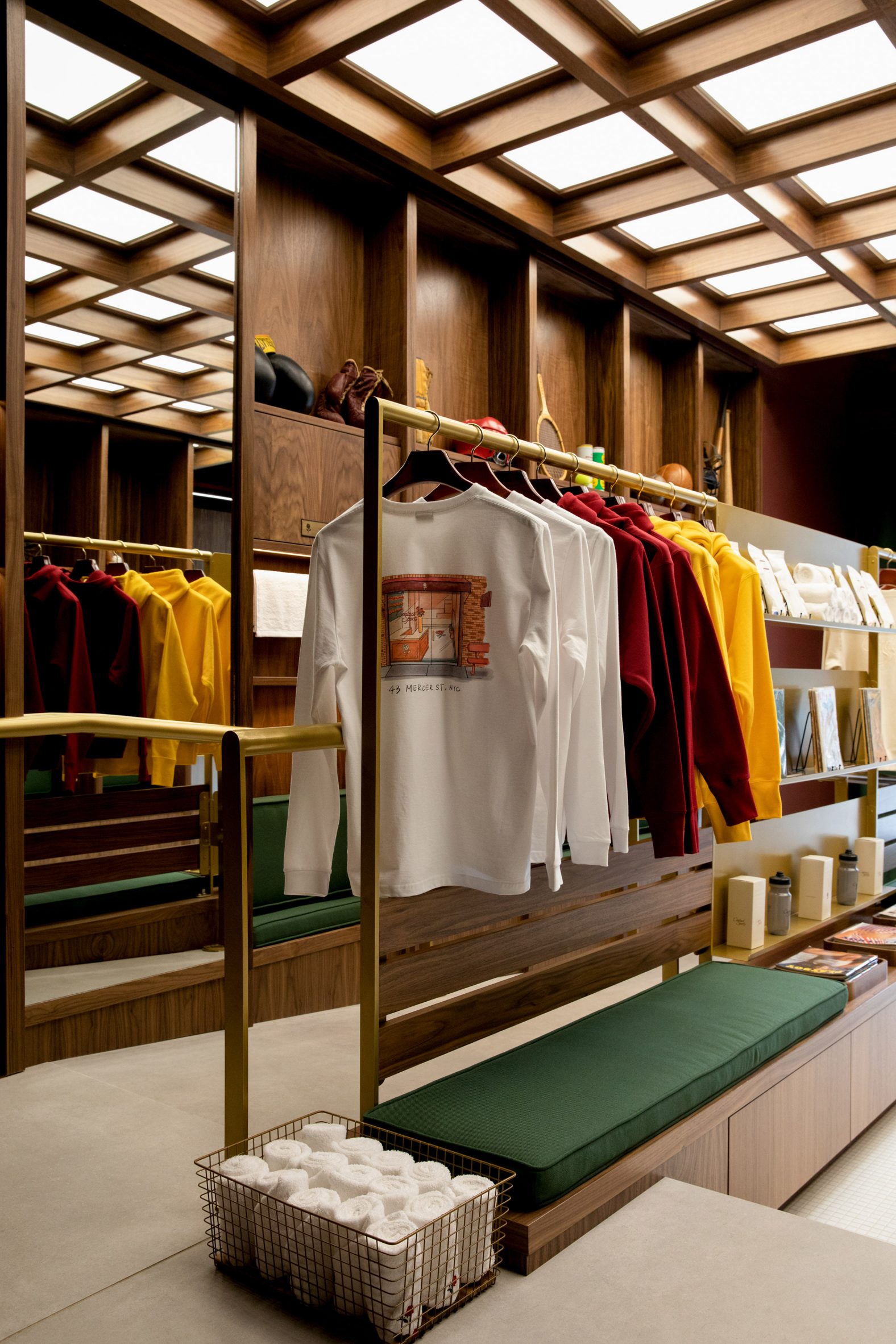 Merchandise displayed on brass rails and shelving