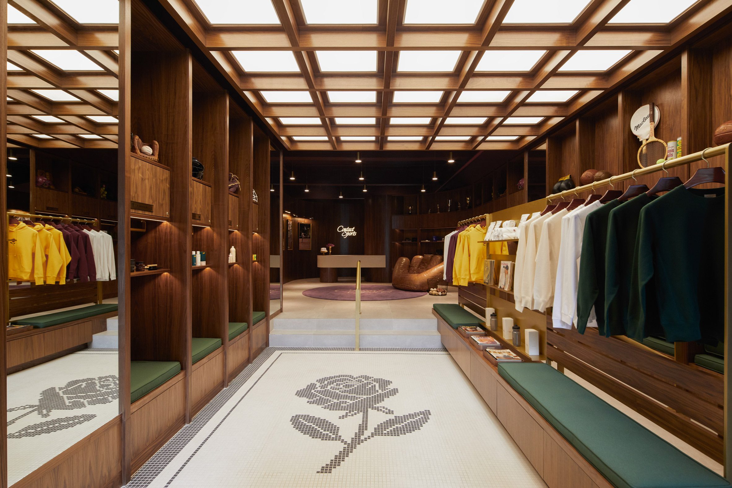 Store interior with walnut shelving and mosaic floor