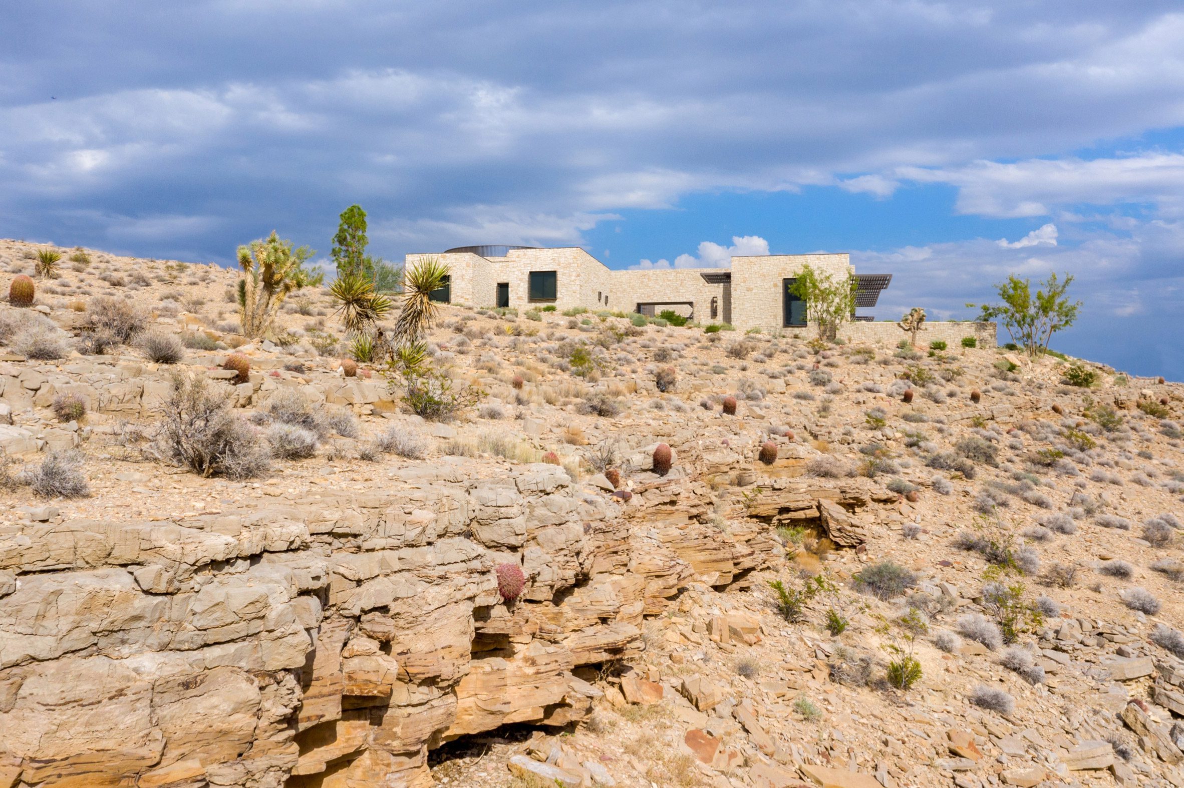 Facade of stone house placed on rocky hillside of Las Vegas desert