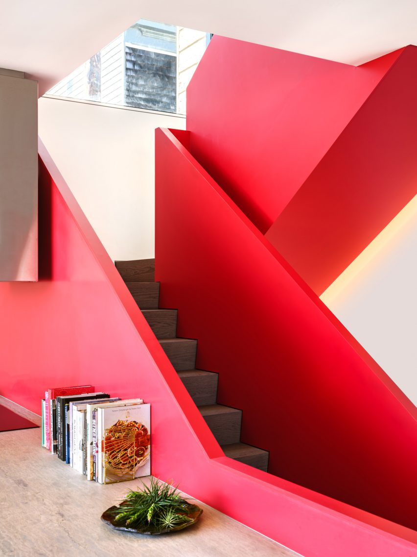 A staircase with red balustrades
