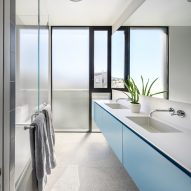 Bathroom with blue vanity units
