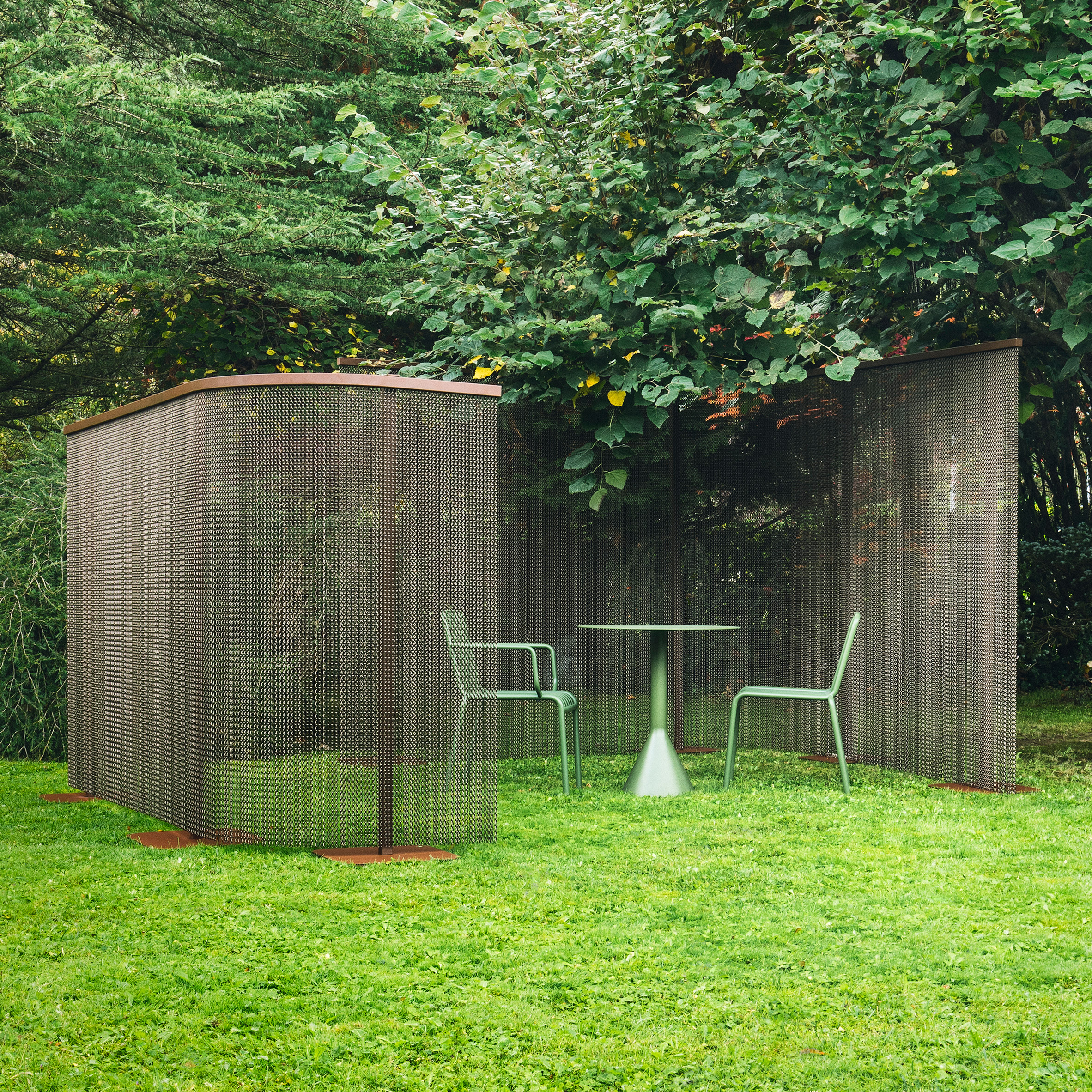 Feel Free chain curtain room divider by Kriskadecor in a garden