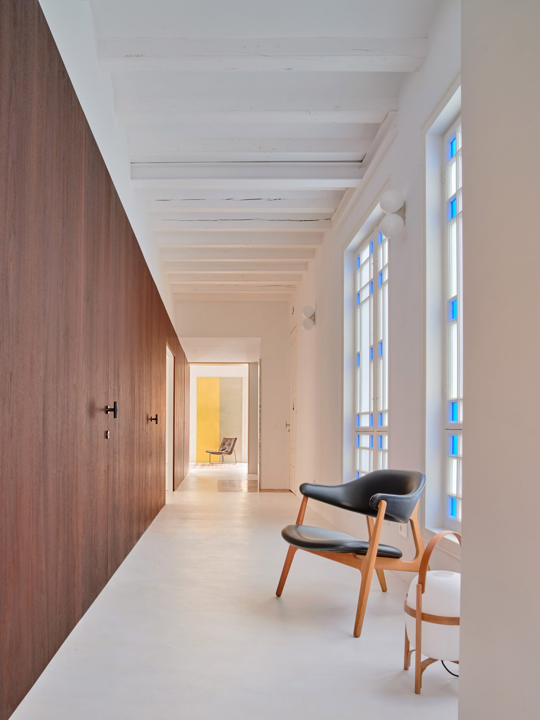 Apartment designed by Raúl Sanchez Architects features walnut wood wall