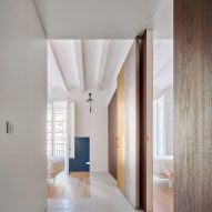 Girona Street apartment designed by Raúl Sanchez Architects features walnut wood wall