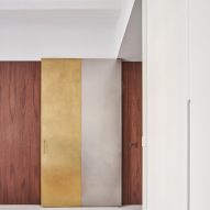 Girona Street apartment designed by Raúl Sanchez Architects features brass and steel door