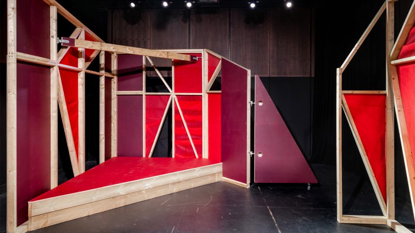 Triangular stages with timber frames and red netting built by school children and Matt+Fiona