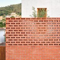 Exterior of House on a Brick Base by Agora Arquitectura