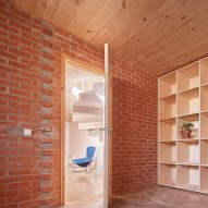 Interior of House on a Brick Base by Agora Arquitectura