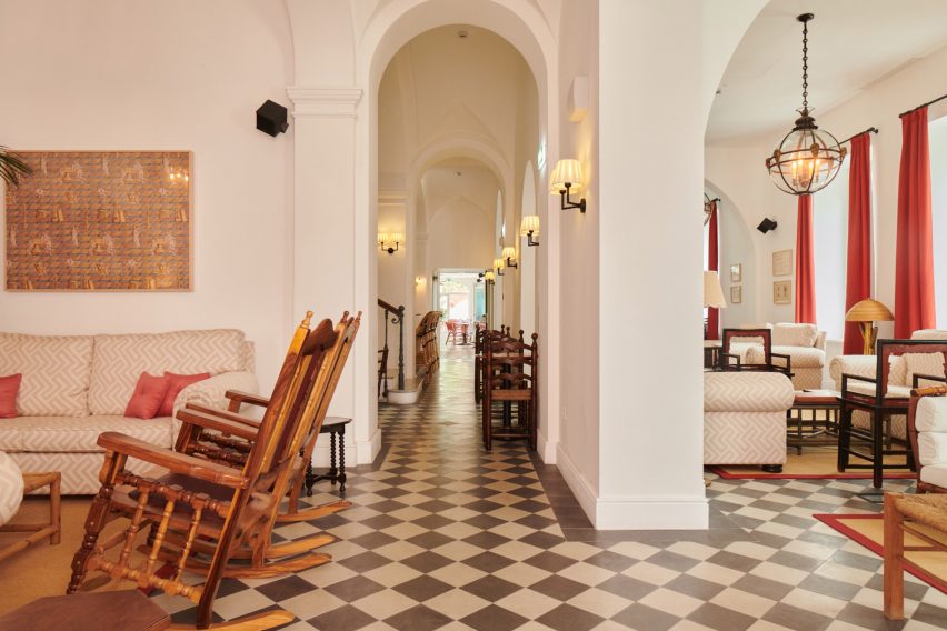 Lounge areas with vintage furniture and checkerboard floor