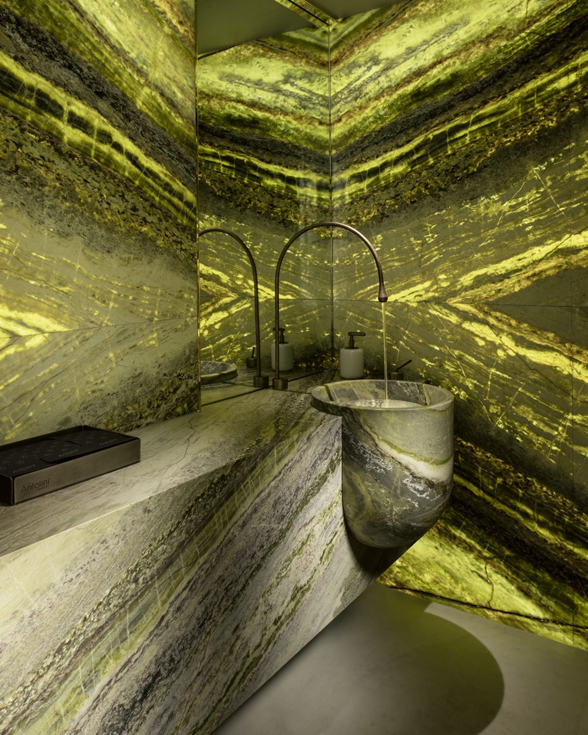 Irish Green marble by Antolini used on bathroom walls, sink and vanity unit