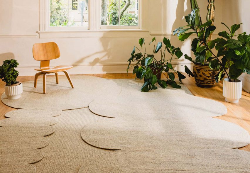 Rounded woven rugs laid overlapping on living room floor