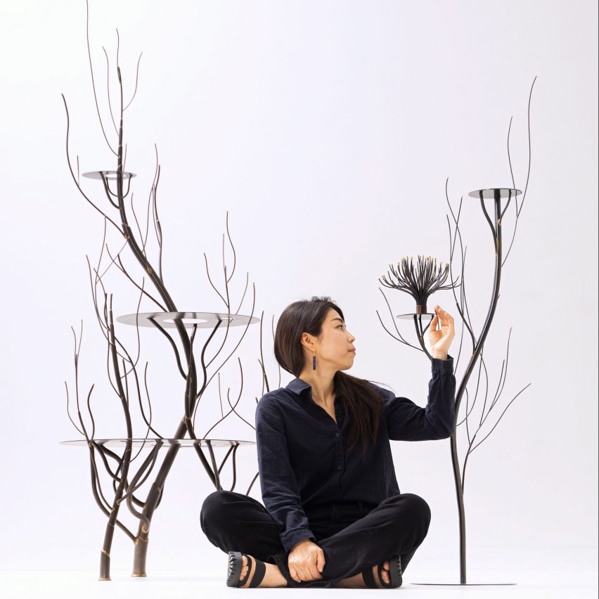 Ayako Aratini next to her sculptural furniture design