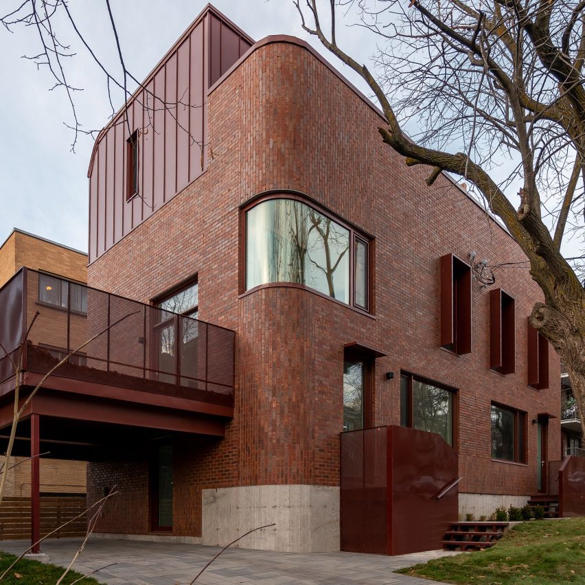 Red brick Montreal duplex with curved edges and windows