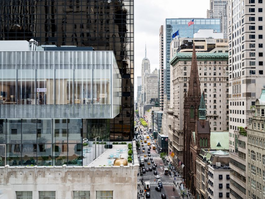 Stacked glass volumes of Tiffany addition with 5th Avenue and Empire State Building in background