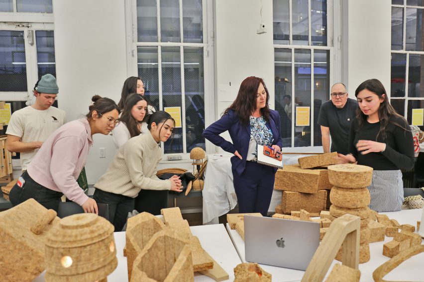 Students gathered around a table with cork objects