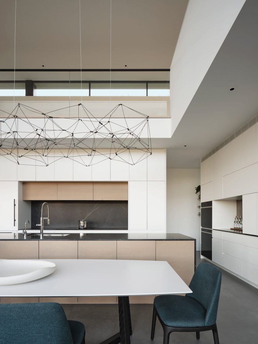 Kitchen with clerestory window and metal chandelier