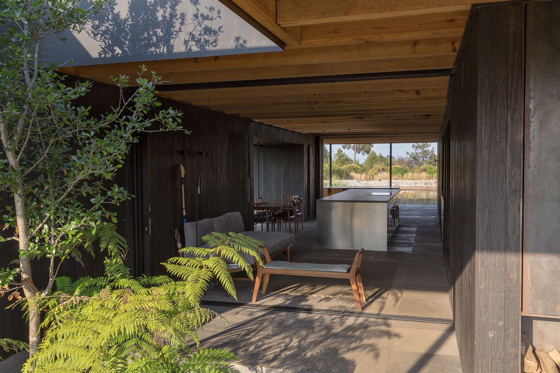 Kitchen clad with stone and wood