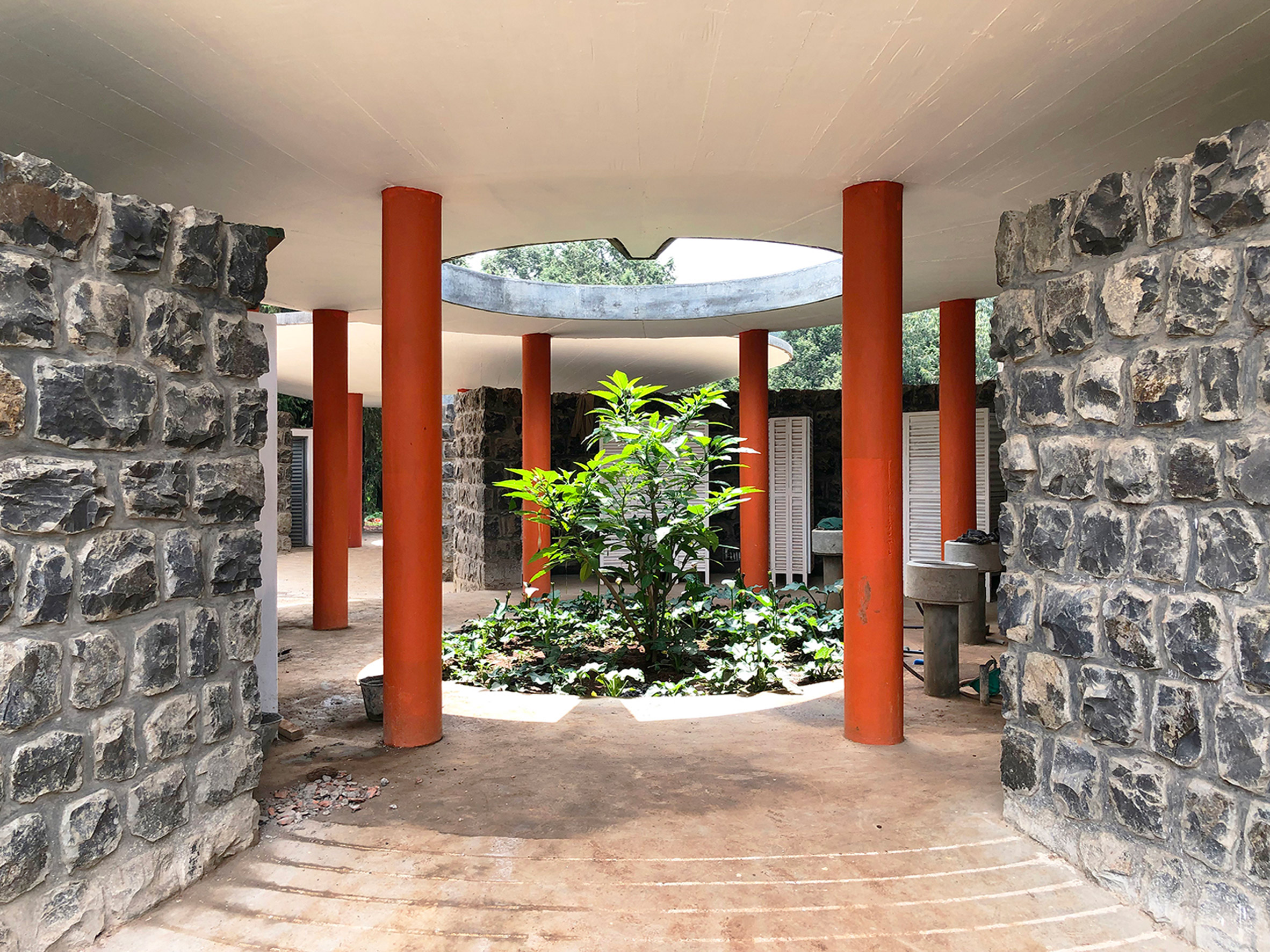 Stone pavilion with a central courtyard by Studio Other Spaces