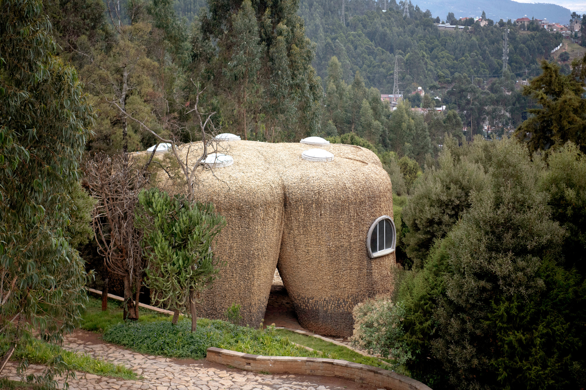 Stone research centre on a hillside at the Meles Zenawi Memorial Park by Studio Other Spaces