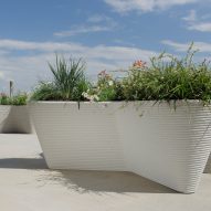Planters on gravel in front of sea view
