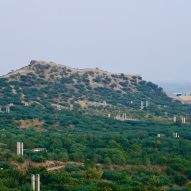 A hilltop with a fort wall and the Smritivan Earthquake Memorial and Museum