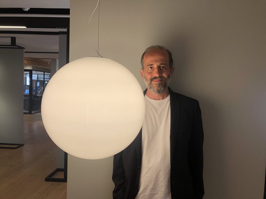 Michael Anastassiades photographed by Dezeen editor-at-large Amy Frearson when she ran into him at the Flos exhibition earlier in the week