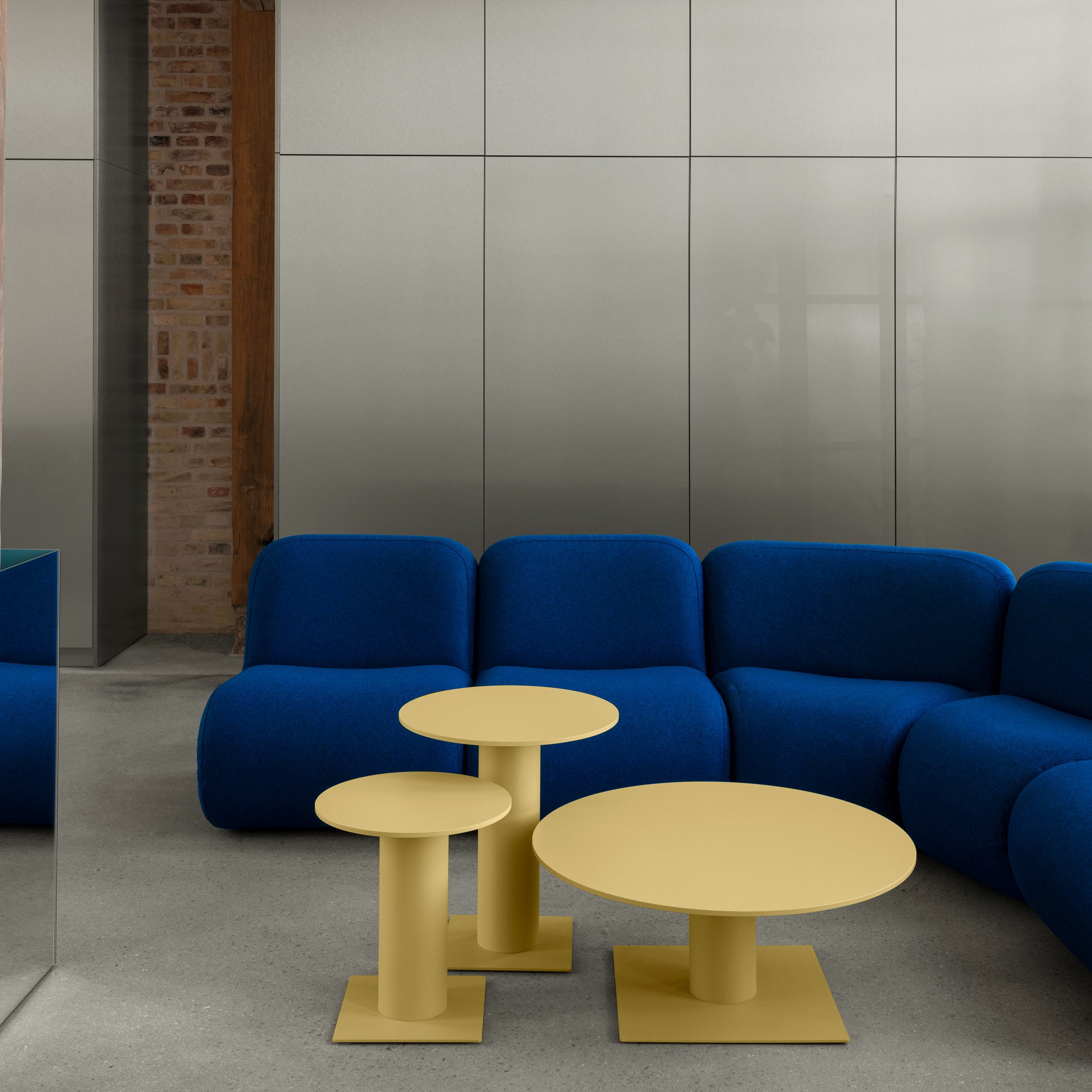 Blue sofa and yellow tables