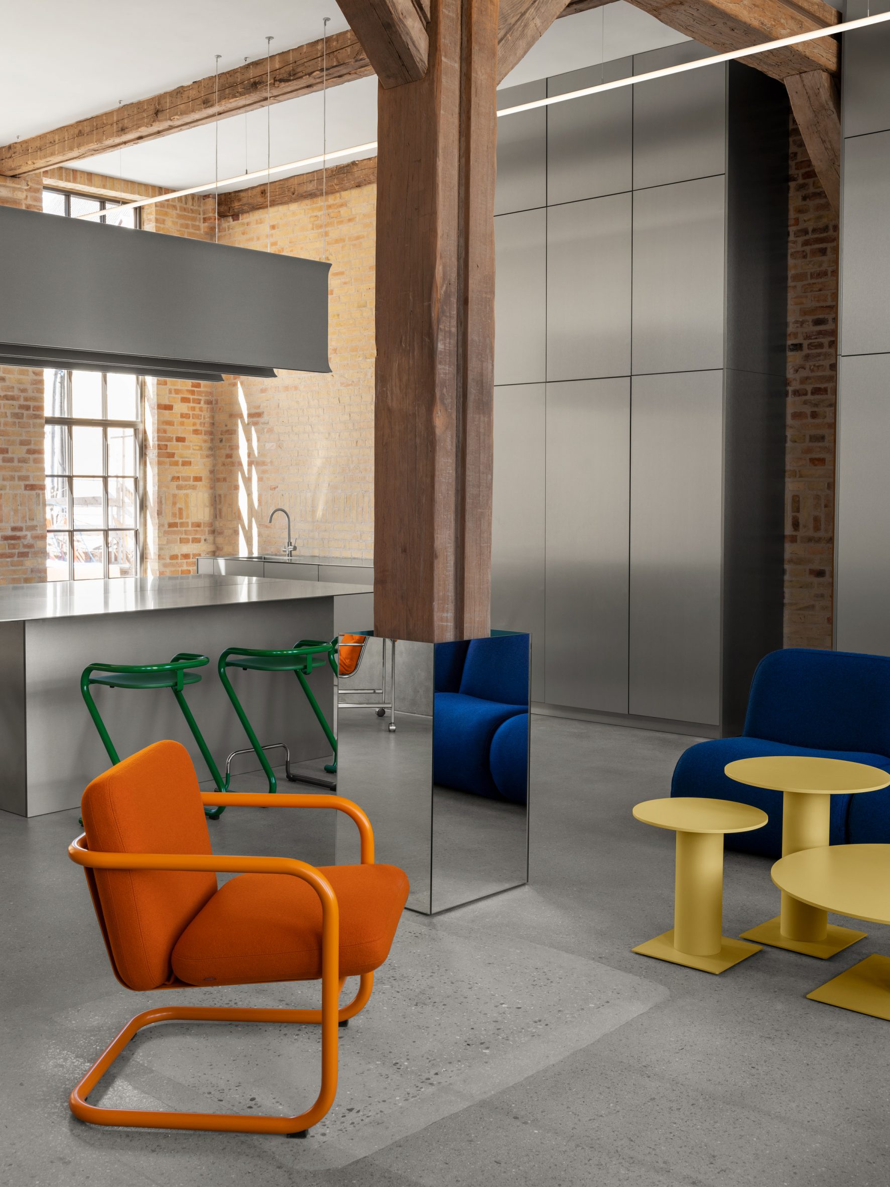 Lammhults Design Group orange chairs, green stools and yellow tables