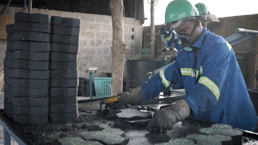 Person making recycled plastic paving slabs for Green Industry Plast