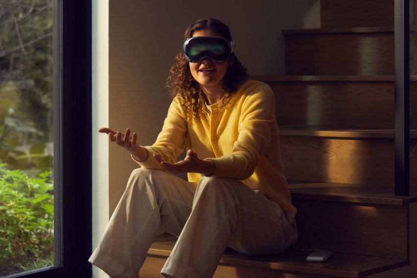 Woman looking through VR headset