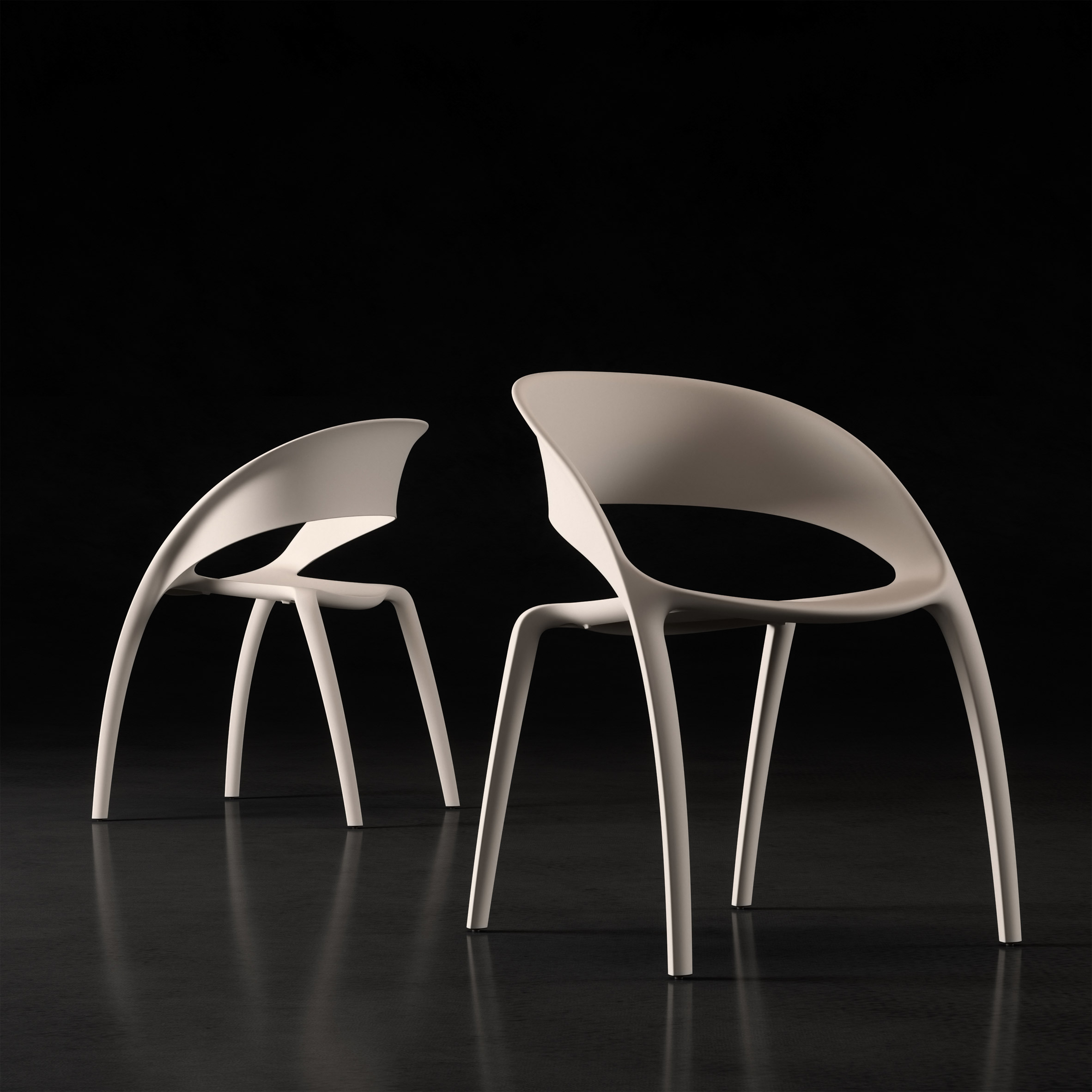 Two cream Bee chairs by Actiu with a curved backrest extending to form two front legs
