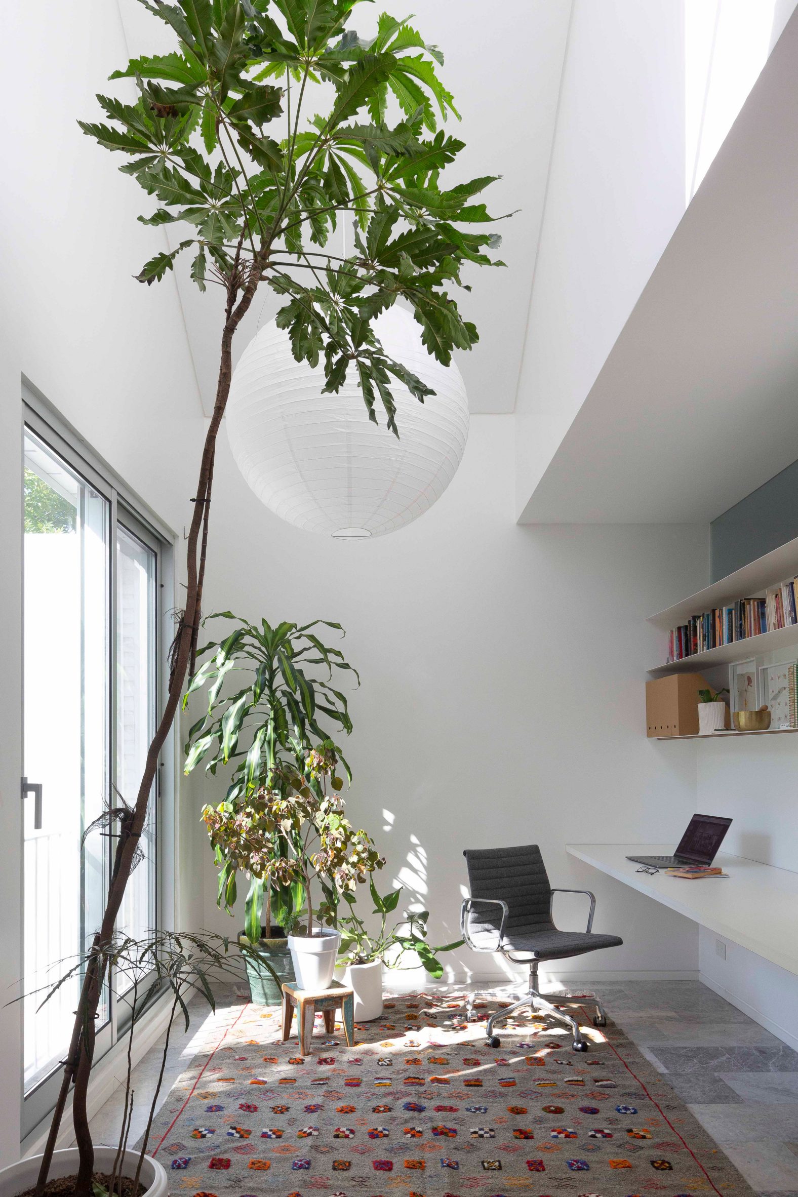 Double-height white-walled office space