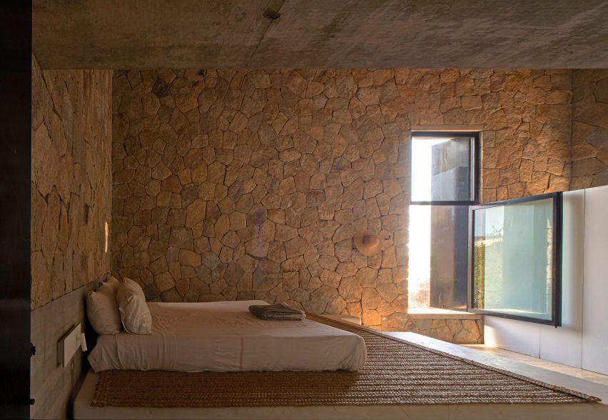 Bedroom with stone walls