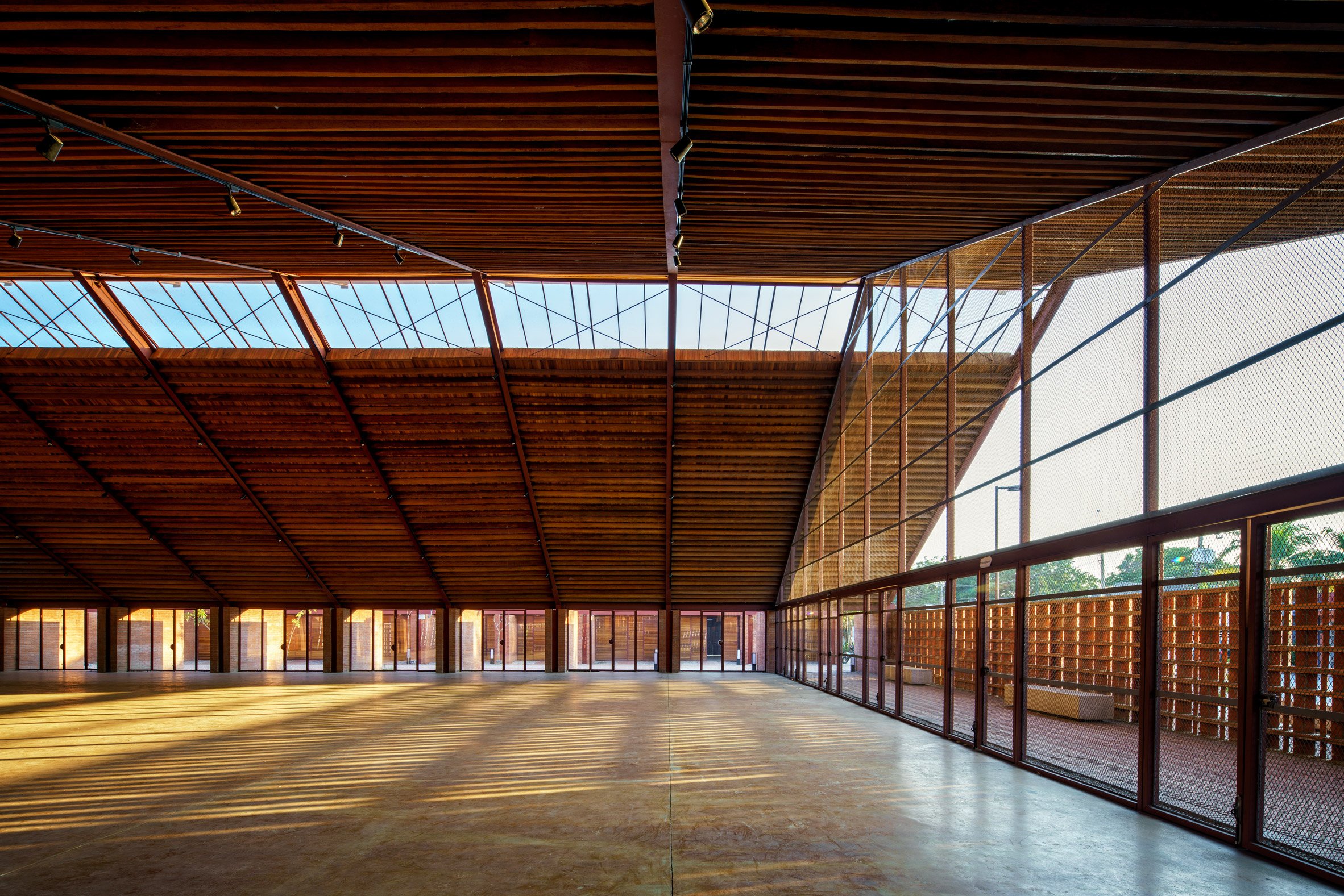 An expansive interior space with a large pitched timber roof and glazed gable end