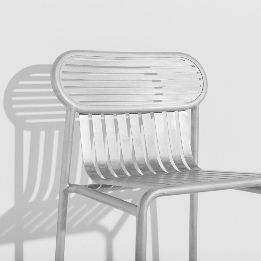 Shiny silver garden chair on white background