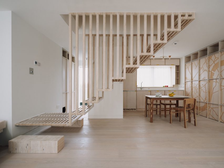 Staircase and kitchen in Dragon Flat by Tsuruta Architects
