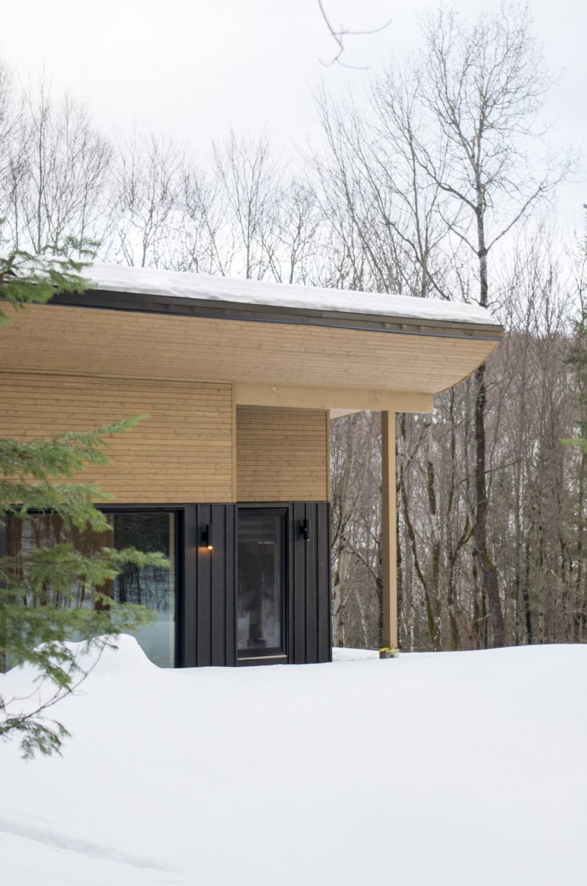 Wooden soffit and curved roof with snow drifts