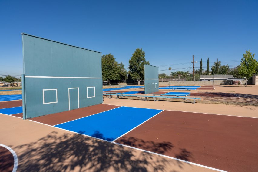 Wall ball court with solar-reflective coating