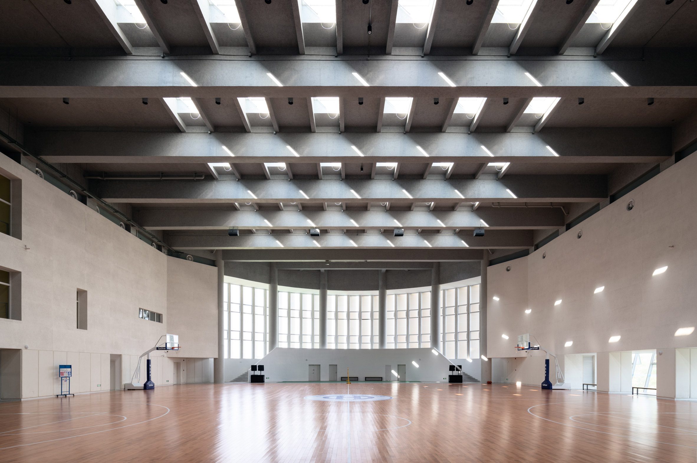 Triple-height gymnasium with skylights