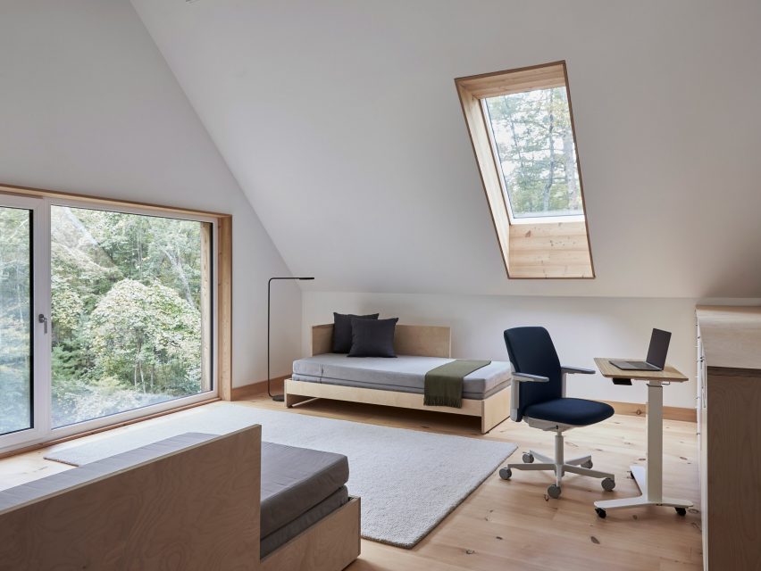 Blue Path office chair by Humanscale in a loft conversion with a desk and sofa bed