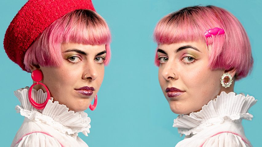 Two people with pink hair against a blue background