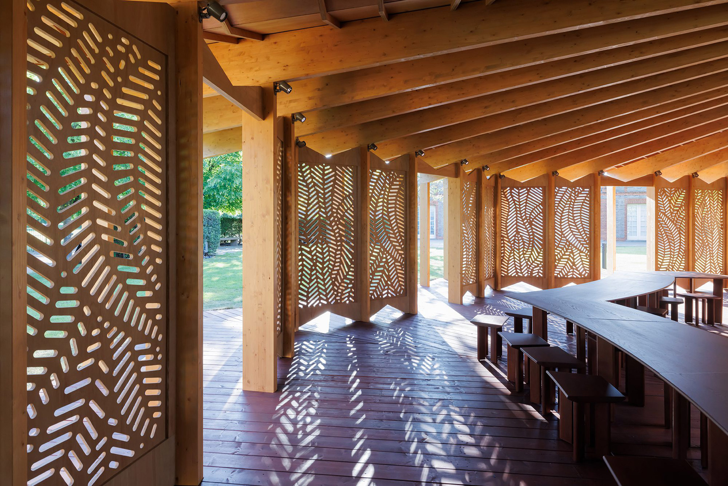 Perforated wooden screens in timber pavilion