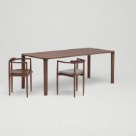 Dark wood Miau table by Koyori with two armchairs