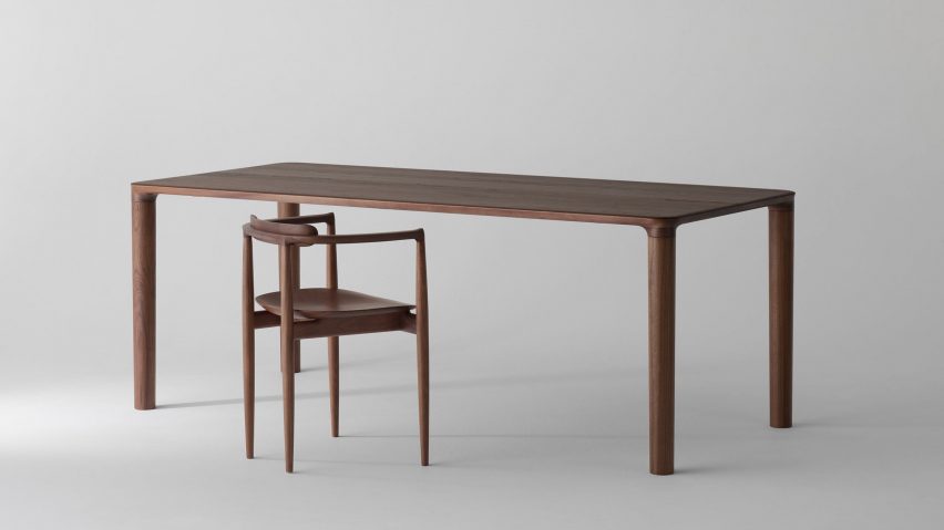 Dark wood Maiu table by Koyori with an armchair
