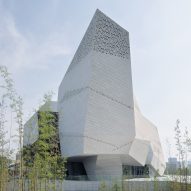 Mountain landscapes inform perforated-granite-clad Chengdu Natural History Museum