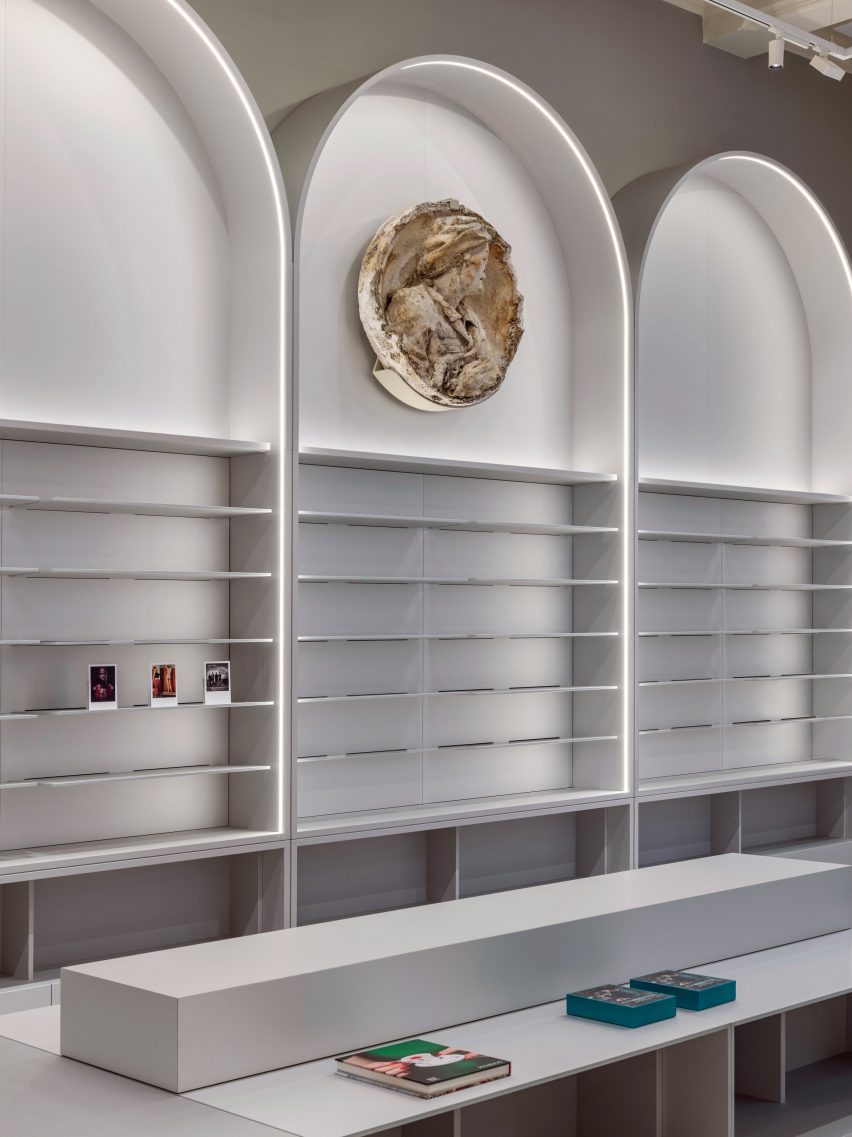 Arched display stands in shops by Alex Cochrane Architects